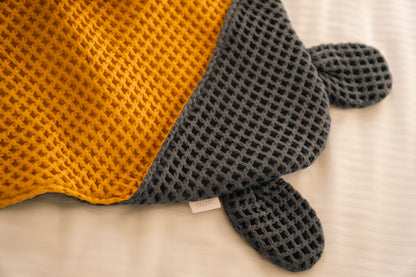 Cape de bain bébé en nid d'abeille