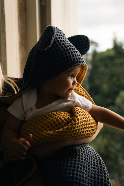 Cape de bain bébé en nid d'abeille