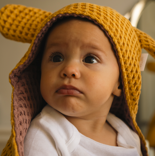 Cape de bain bébé en nid d'abeille